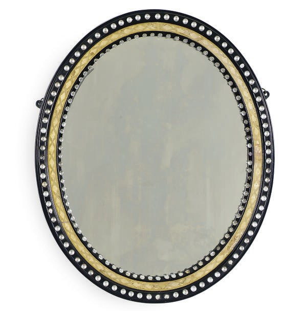 AN IRISH VICTORIAN EBONIZED, PARCEL-GILT AND CUT-GLASS OVAL MIRROR,