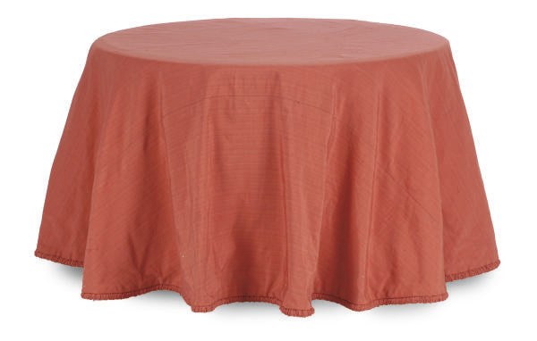 A RED FABRIC COVERED ROUND SIDE TABLE,