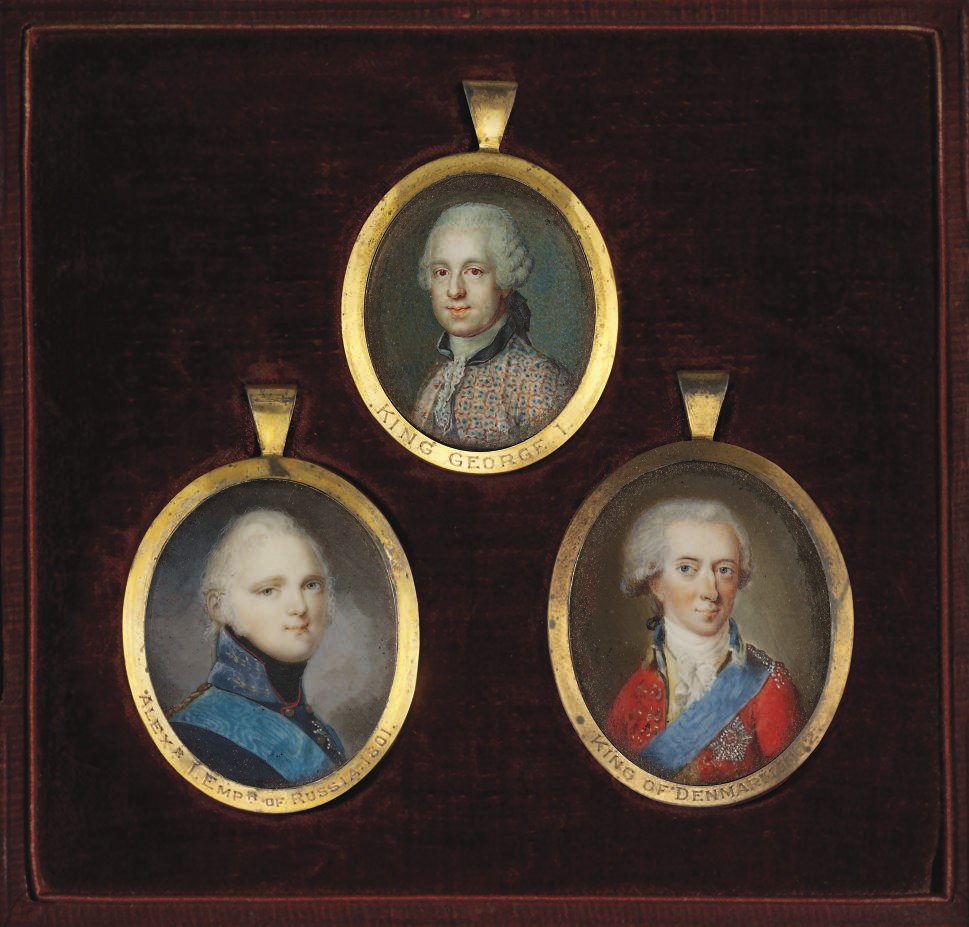 A FRAME CONTAINING THREE PORTRAIT MINIATURES