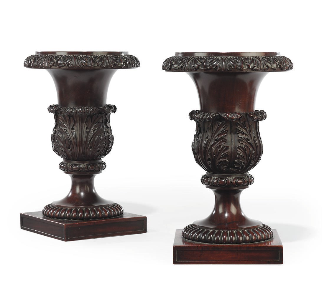 A PAIR OF GEORGE IV MAHOGANY SOLID VASES