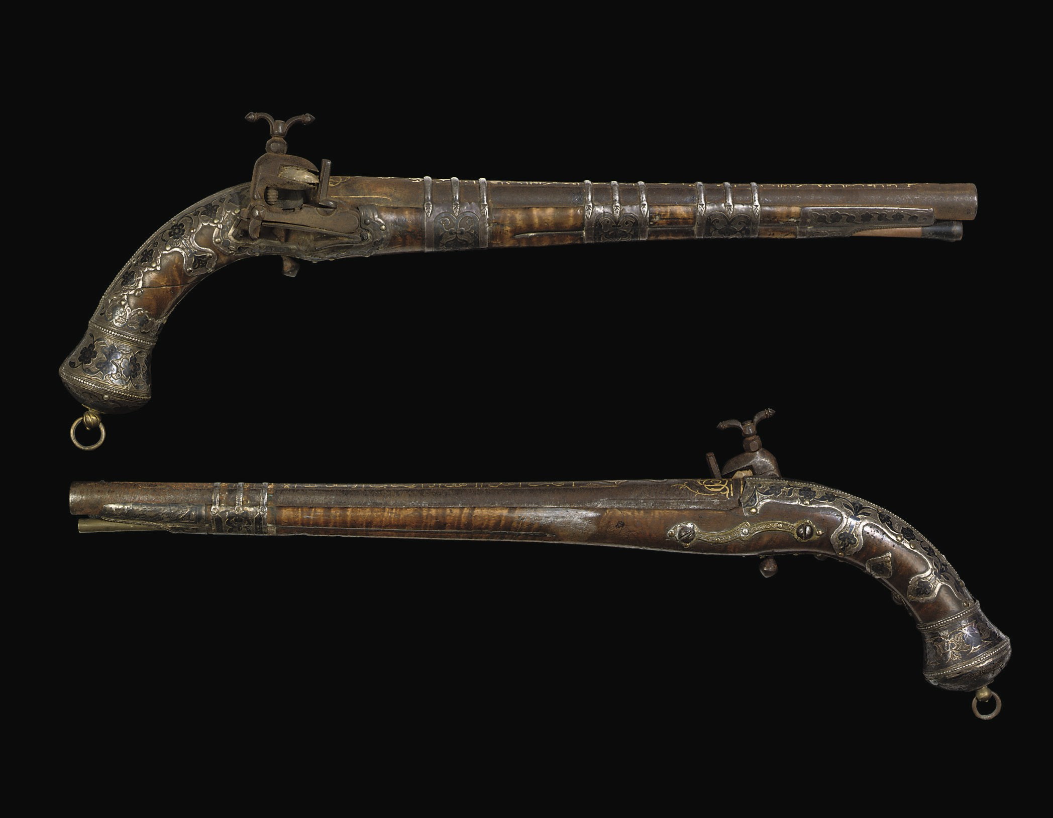 A CAUCASIAN SILVER-MOUNTED MIQUELET-LOCK PISTOL; AND ANOTHER, SIMILAR