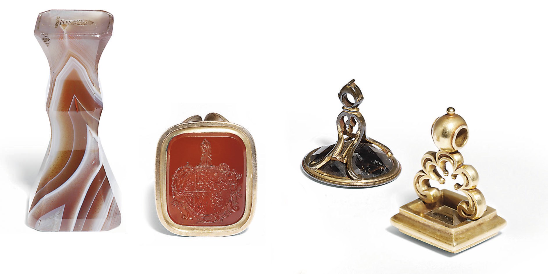 THREE GOLD AND GILT-METAL-MOUNTED FOB SEALS AND ONE HARDSTONE FOB SEAL
