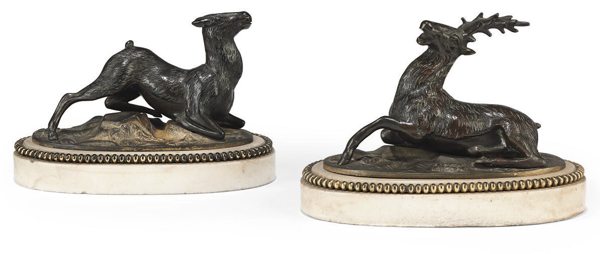 A PAIR OF FRENCH BRONZE AND MARBLE PRESSE-PAPIERS