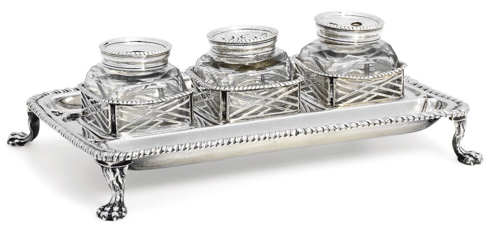 A GEORGE III SILVER THREE-BOTTLE INKSTAND