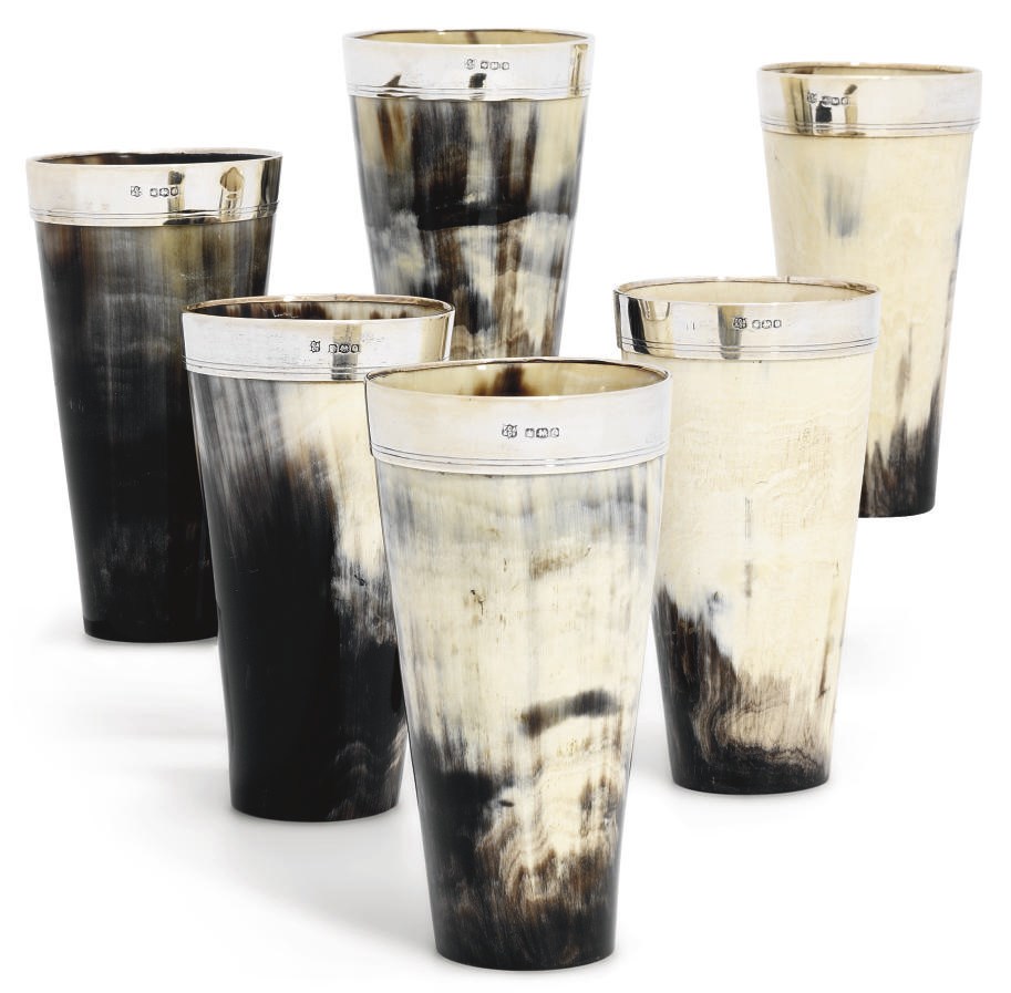 A SET OF SIX GEORGE V SILVER-MOUNTED HORN BEAKERS