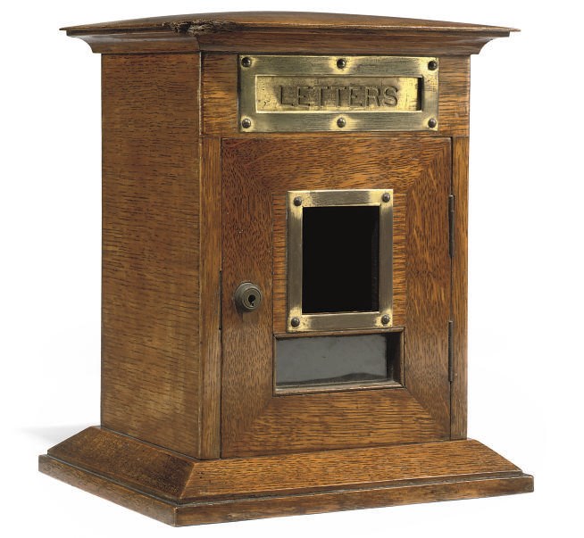 A LATE VICTORIAN BRASS-MOUNTED OAK LETTERBOX