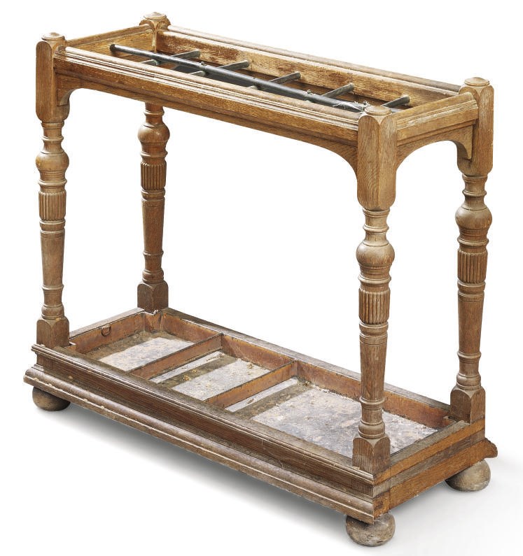 A LATE VICTORIAN OAK STICK-STAND