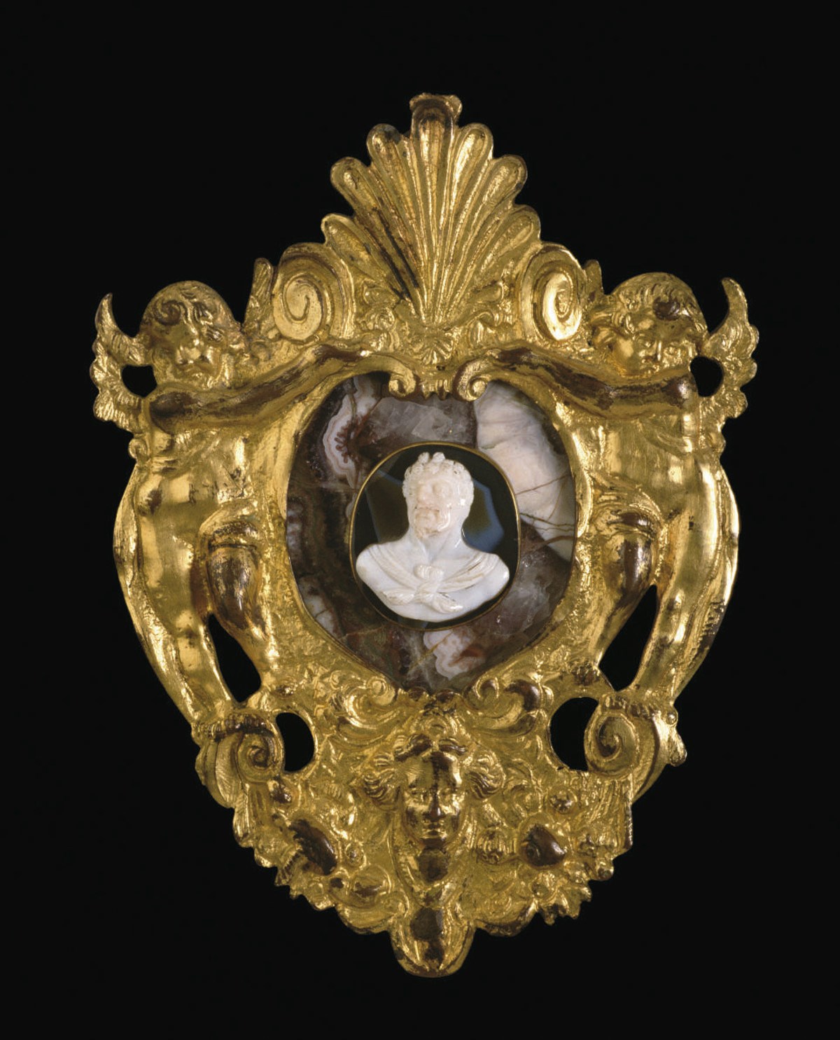 CAMEE OVALE EN ONYX SCULPTE REPRESENTANT UN BUSTE DE FAUNE