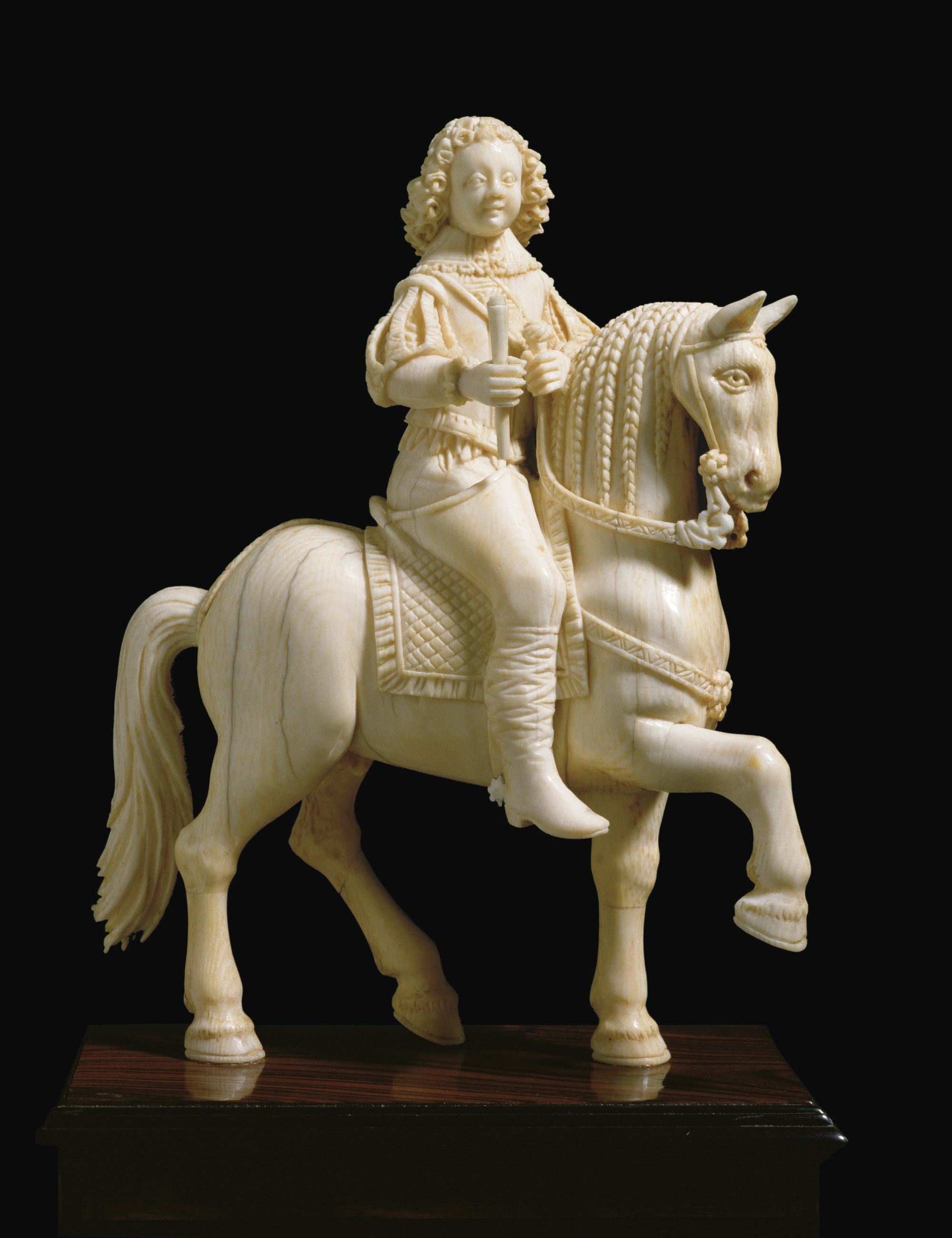 GROUPE REPRESENTANT UN JEUNE HOMME A CHEVAL