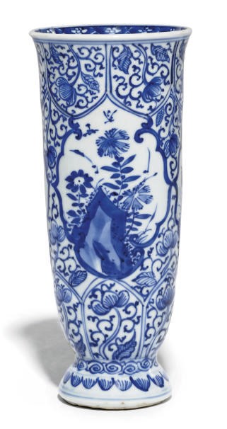 A CHINESE BLUE AND WHITE BEAKER VASE