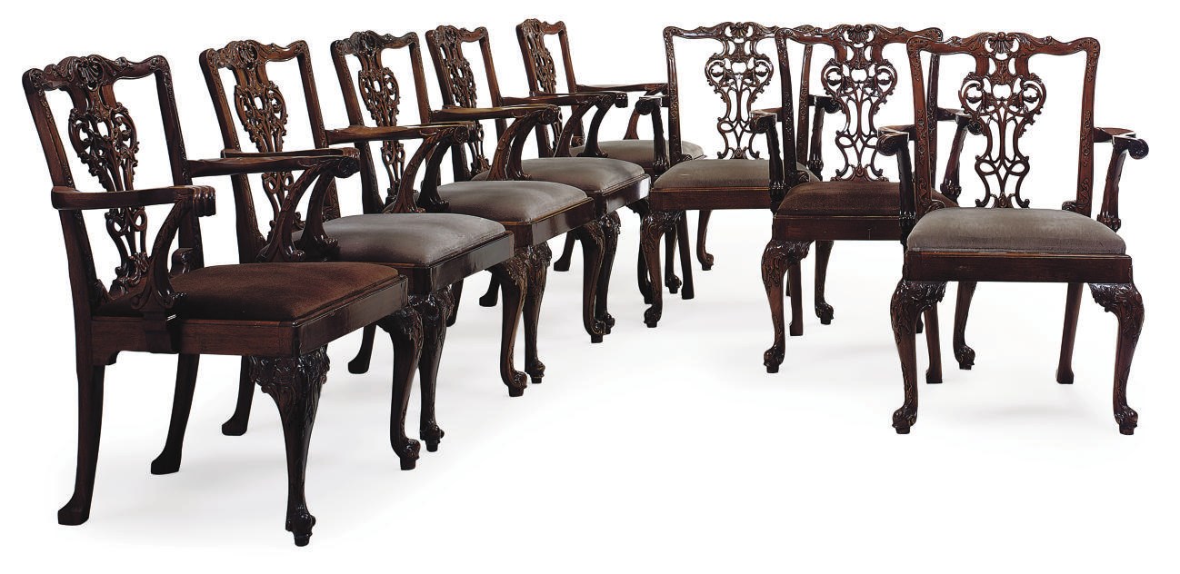 A SET OF EIGHT WALNUT DINING CHAIRS