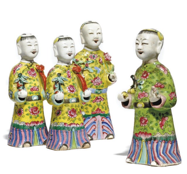 FOUR CHINESE FAMILLE ROSE PORCELAIN BOY FIGURES