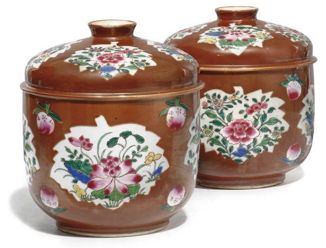 A PAIR OF CHINESE FAMILLE ROSE CAFE-AU-LAIT GROUND POTICHE JARS AND COVERS