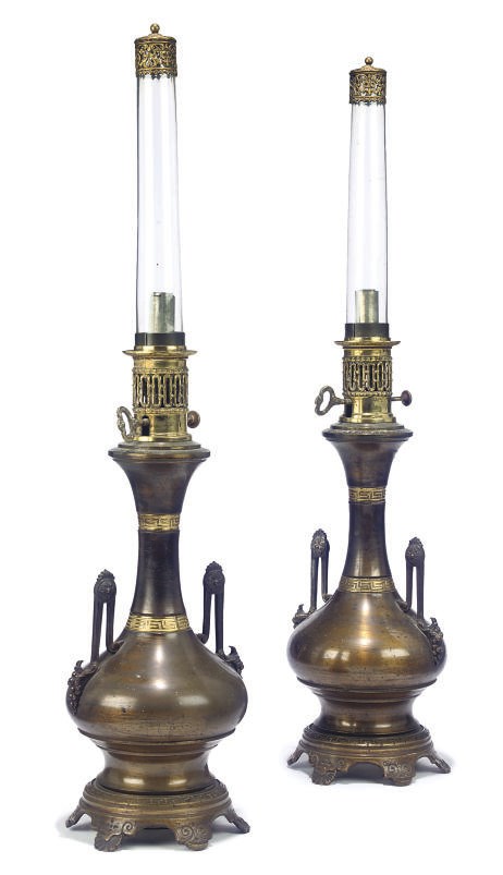 A PAIR OF FRENCH LACQUERED AND GILT BRASS OIL LAMPS