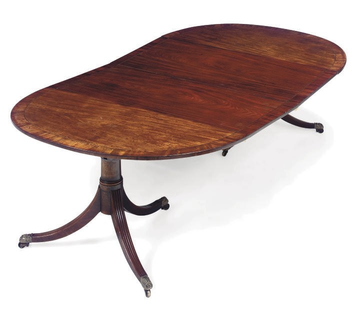 A REGENCY MAHOGANY TWIN PEDESTAL DINING TABLE
