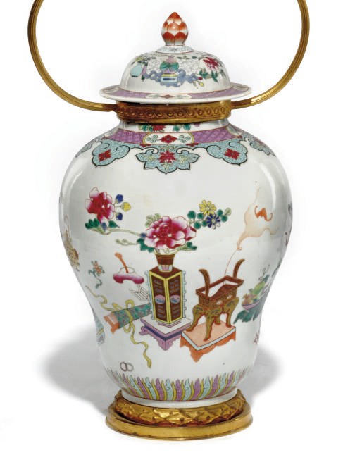 A CHINESE FAMILLE ROSE LAMPED JAR AND COVER