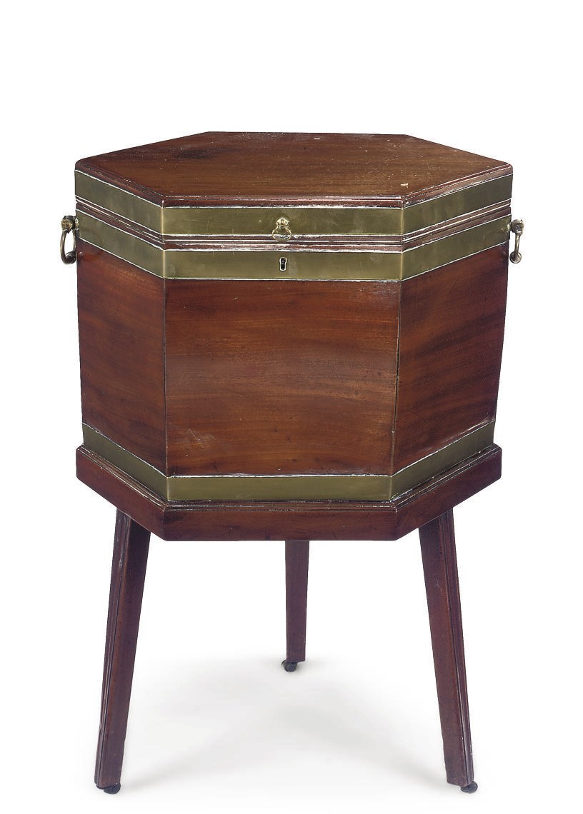 A GEORGE III MAHOGANY BRASS BOUND HEXAGONAL CELLARET