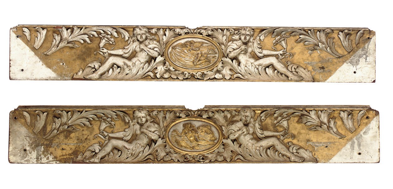 A PAIR OF CARVED WOOD RELIEF PANELS