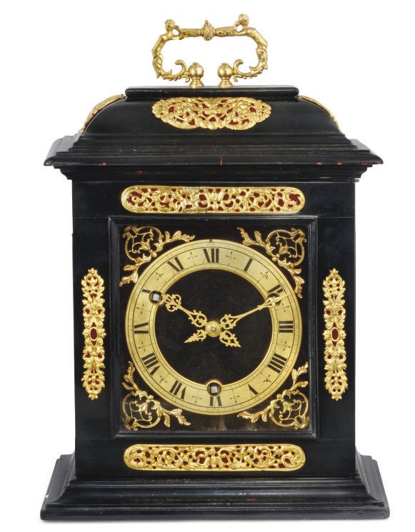 A GILT-BRASS MOUNTED EBONISED QUARTER STRIKING TABLE CLOCK