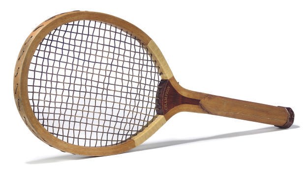A NOVELTY OUTSIZE ADVERTISING TENNIS RACKET