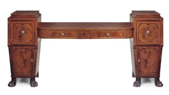 A LATE REGENCY MAHOGANY AND TULIPWOOD CROSSBANDED PEDESTAL SIDEBOARD