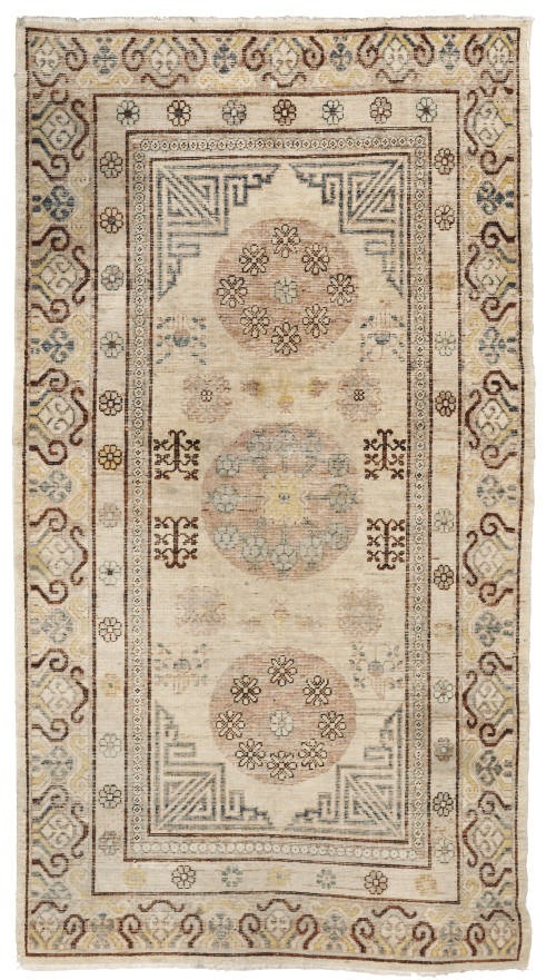 An antique Khotan large rug