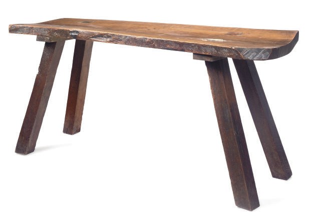 A RUSTIC OAK SERVING-TABLE