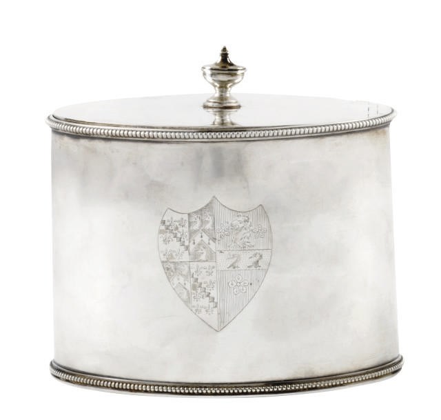 A GEORGE III OVAL SILVER TEA CADDY