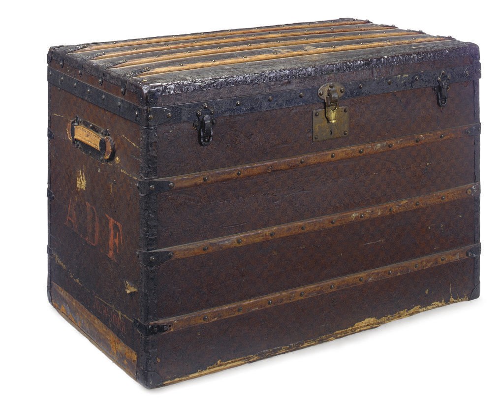 A FRENCH METAL AND WOOD-MOUNTED LEATHER LUGGAGE TRUNK