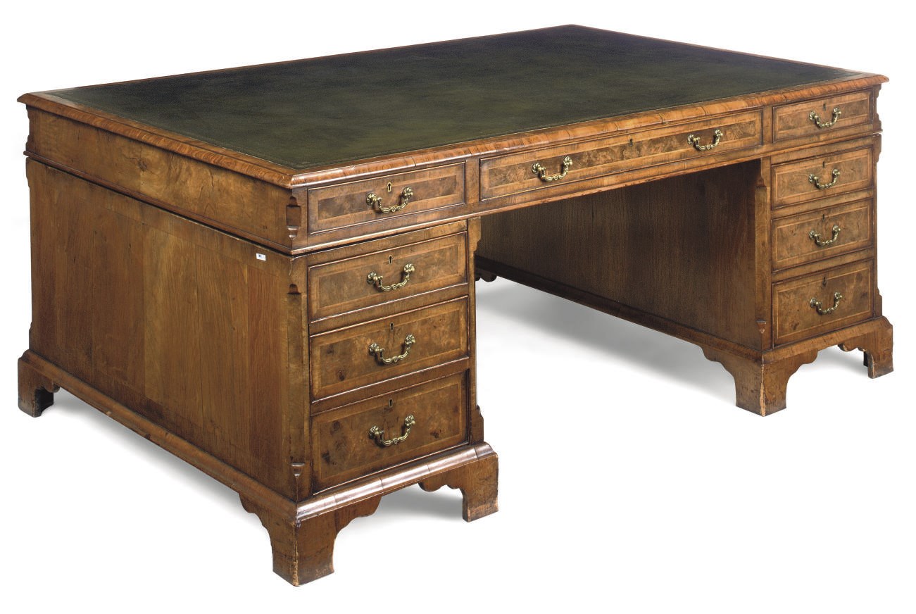 AN EDWARDIAN WALNUT FEATHER CROSSBANDED BANDED PARTNER'S DESK