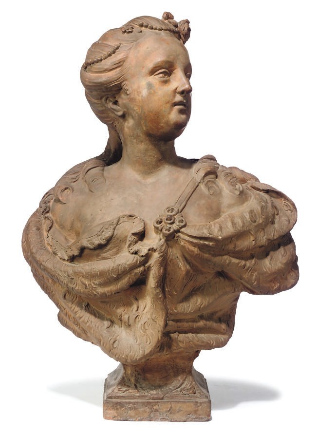 A TERRACOTTA BUST OF A WOMAN