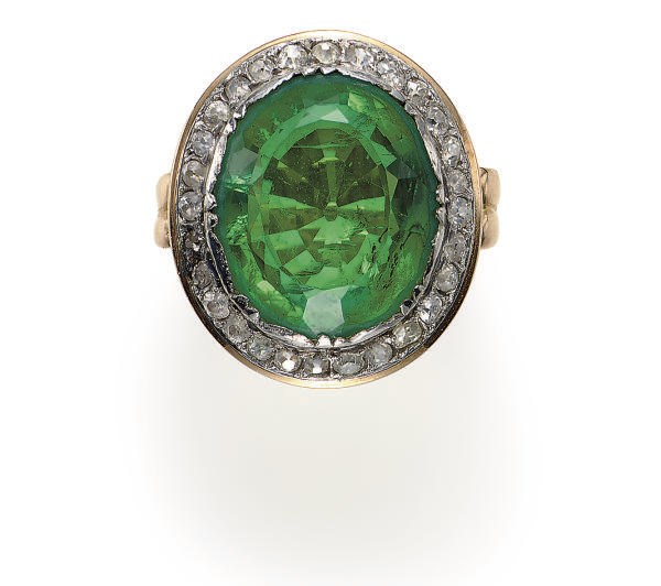 A SIMULATED EMERALD, DIAMOND AND 18K GOLD RING