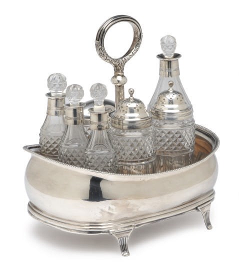 A GEORGE III SILVER CRUET SET WITH SEVEN SILVER-MOUNTED CUT-GLASS BOTTLES,