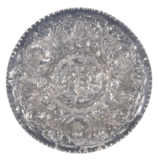 A SILVER DISH WITH REPOUSSE COURTING COUPLE,
