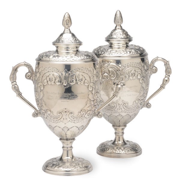 TWO AMERICAN SILVER TWO-HANDLED CUPS AND COVERS,