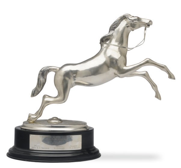 A PERUVIAN SILVER HORSE-FORM TROPHY,