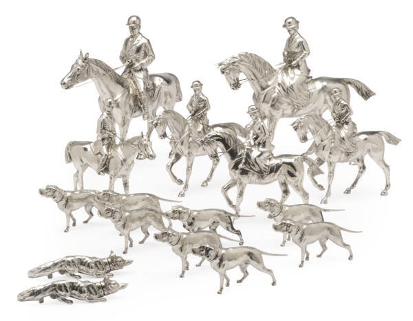 A SILVER-PLATED ORNAMETAL TABLE SET OF A FOX HUNTING PARTY,