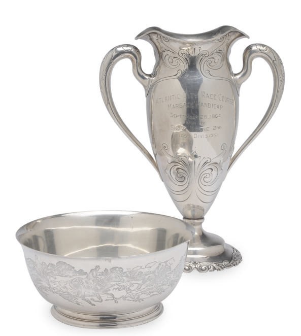 AN AMERICAN SILVER TWO-HANDLED TROPHY AND A TROPHY BOWL,