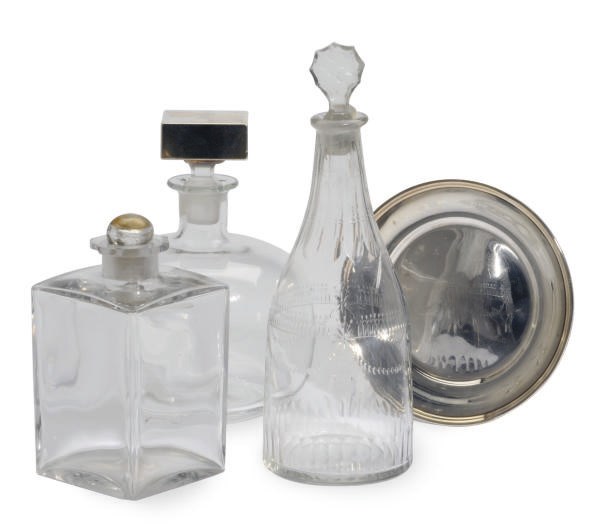 A PAIR OF SILVER-MOUNTED DECANTERS AND THREE SILVER COASTERS,