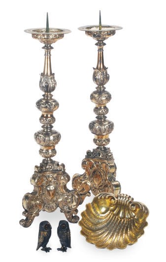 A PAIR OF CONTINENTAL SILVER-PLATED PRICKET STICKS, A SILVER-GILT SHELL FORM BOWL AND A PAIR OF OWL-FORM CASTERS,