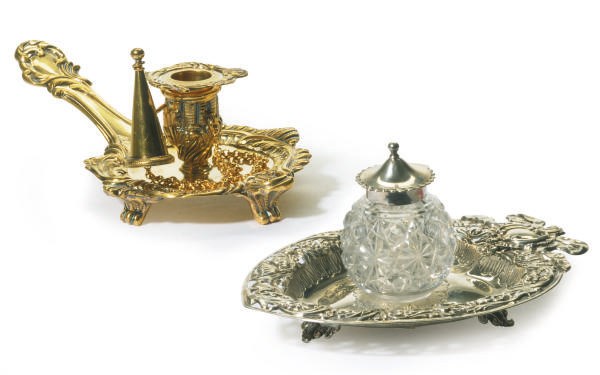 A GEORGE III SILVER-GILT CHAMBER STICK AND A VICTORIAN SILVER-MOUNTED INK POT AND STAND,