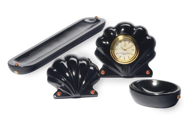 AN AMERICAN RED CORAL AND GOLD MOUNTED ONYX DESK SET,