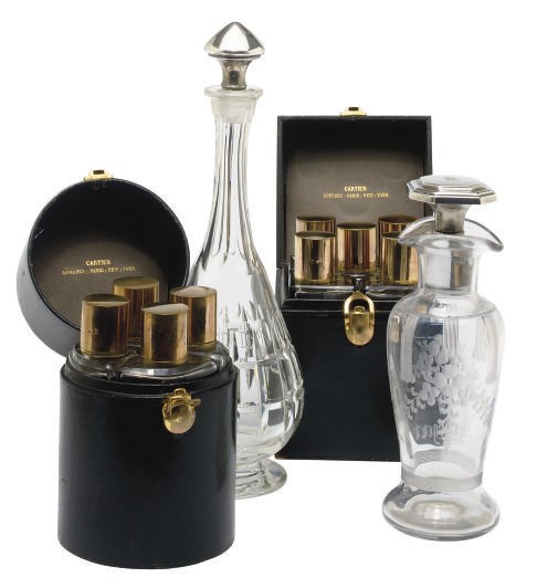 A GROUP OF AMERICAN SILVER CANDLESTICKS AND TWO FRENCH LEATHER TRAVEL CASES,