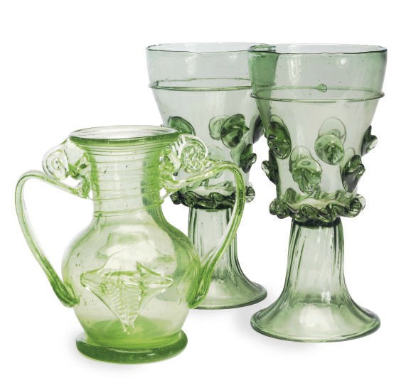 A PAIR OF CONTINENTAL GREEN GLASS GOBLETS AND A TWO-HANDLED JUG,