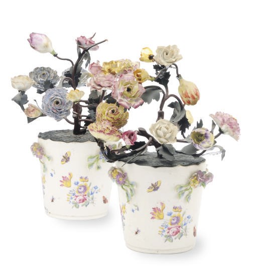 A PAIR OF TÔLE AND PORCELAIN MENNECY STYLE POTS OF FLOWERS,
