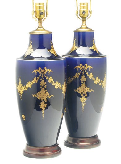 A PAIR OF SEVRES-STYLE COBALT VASES MOUNTED AS LAMPS,