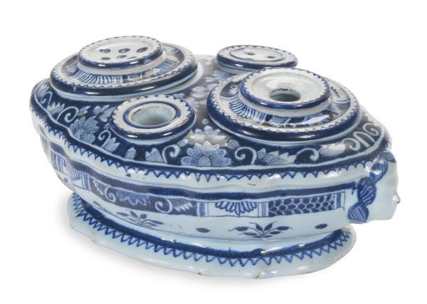 A CONTINENTAL FAIENCE FITTED INKSTAND,
