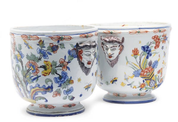 A PAIR OF CONTINENTAL FAIENCE JARDINIERES WITH SAYTR MASK HANDLES,