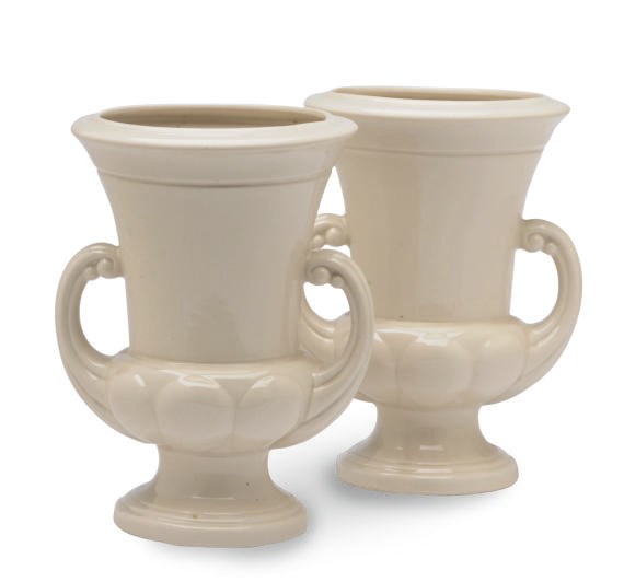 A PAIR OF AMERICAN WHITE-GLAZED CAMPANA-FORM VASES ON PEDESTAL FEET,