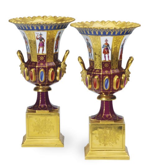 A PAIR OF FRENCH GOTHIC REVIVAL CLARET AND GOLD-GROUND TWO HANDLED VASES ON SQUARE PLINTHS,